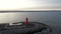 Lighthouse on the west breakwater in Nowy Port at sunset, GdaÃâsk.